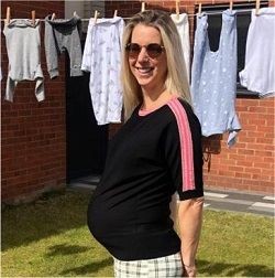 Image of pregnant Gemma Wood in her garden