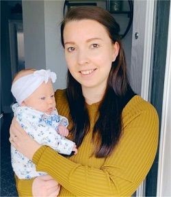 Image of Polly Tarrant holding her newborn baby