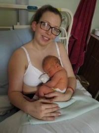 Martine Monksfield holding newborn baby in hospital