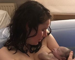 Hannah Lyons in birth pool with newborn