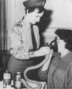Old picture of woman using gas and air machine