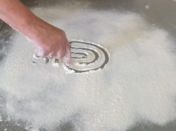 drawing a labyrinth in flour