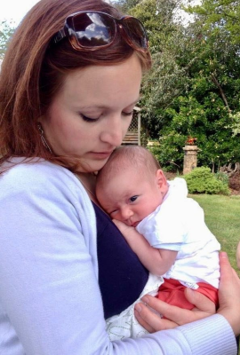 Picture of Danielle Gilmour holding newborn baby